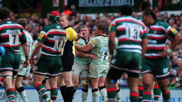 Chris Ashton is held back by captain Dylan Hartley after being punched by Manu Tuilagi (13) in 2011