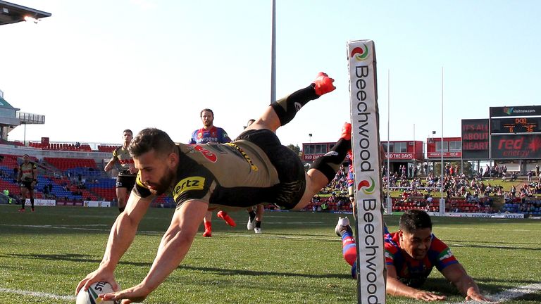 Josh Mansour scores a try against Newcastle Knights