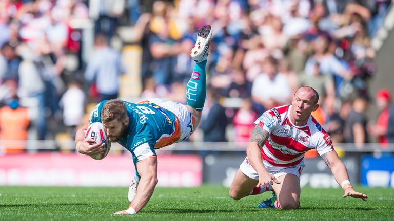 Nick Scruton is tripped up by Leigh hooker Mickey Higham