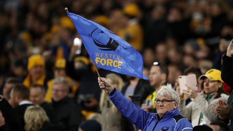 A Western Force supporter waves a flag during the Rugby Championship match between Australia and New Zealand