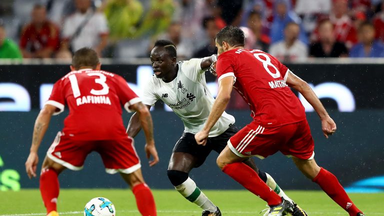 Sadio Mane is challenged by Rafinha and Javi Martinez