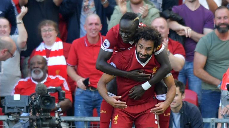 Liverpool's Egyptian midfielder Mohamed Salah (R) celebrates with Liverpool's Senegalese midfielder Sadio Mane after scoring their third goal during the En