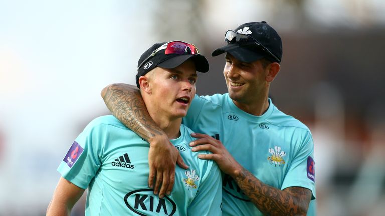 Jade Dernbach and Sam Curran walk off the field during the NatWest T20 Blast match between Surrey and Gloucestershire