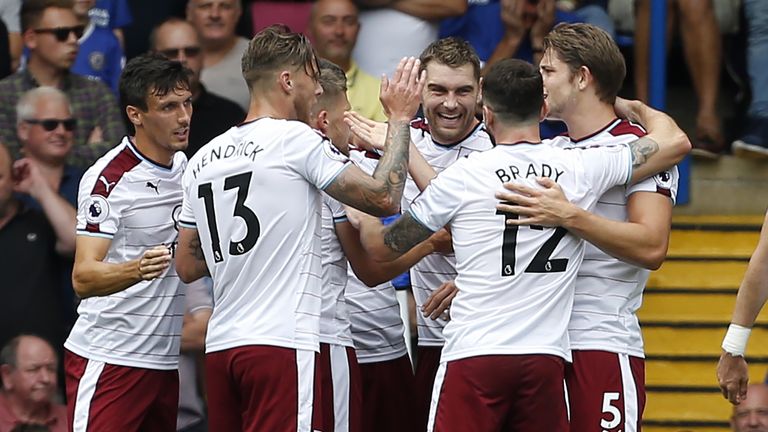 Burnley's Sam Vokes (C) celebrates with team-mates after opening the scoring against Chelsea