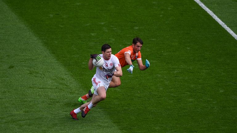 Tyrone's Sean Cavanagh against Stephen Sheridan