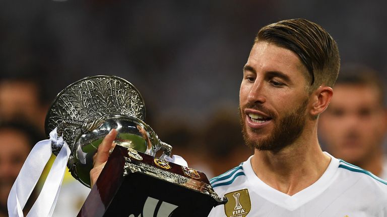 Sergio Ramos holds up the Spanish Super Cup after Real Madrid defeated Barcelona 5-1 on aggregate