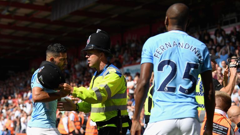BOURNEMOUTH, ENGLAND - AUGUST 26:  Sergio Aguero of Manchester City and Fernandinho of Manchester City argue with a police man during the Premier League ma