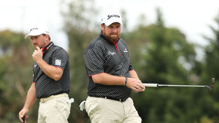 MELBOURNE, AUSTRALIA - NOVEMBER 26:  	Shane Lowry and Graeme McDowell of Ireland look on during day three of the World Cup of Golf at Kingston Heath Golf C