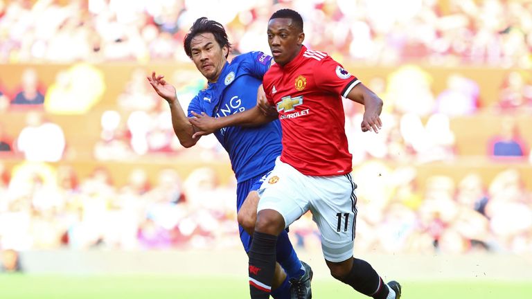 Shinji Okazaki and Anthony Martial in action during the Premier League match at Old Trafford
