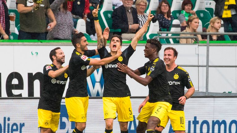 Dortmund´s Spanish defender Marc Bartra (C) celebrates scoring his team's second goal with team mates during the German First division Bundesliga football