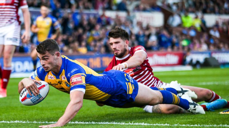 Stevie Ward dives over to score a try