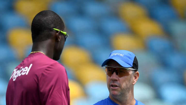 West Indies coach Stuart Law speaks with captain Jason Holder