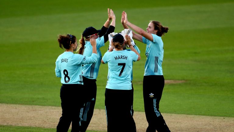 LONDON, ENGLAND - AUGUST 13:  Natalie Sciver of Surrey celebrates with her teammates after dismissing Maddie Walsh of Yorkshire during the Kia Super League