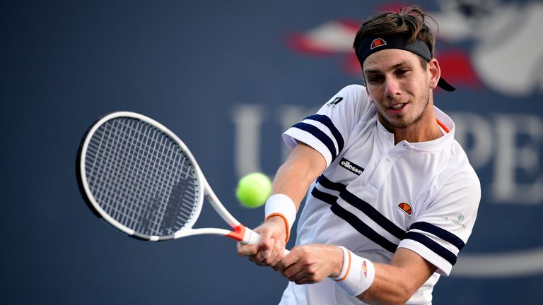 Cameron Norrie of Great Britain returns a shot against Pablo Carreno Busta of Spain during their second round US Open match
