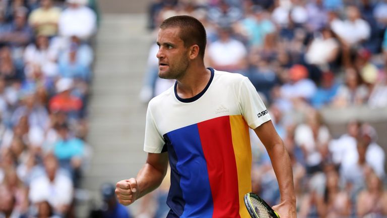 Mikhail Youzhny of Russia reacts against Roger Federer of Switzerland during their second round Men's Singles match on Day Four at US Open