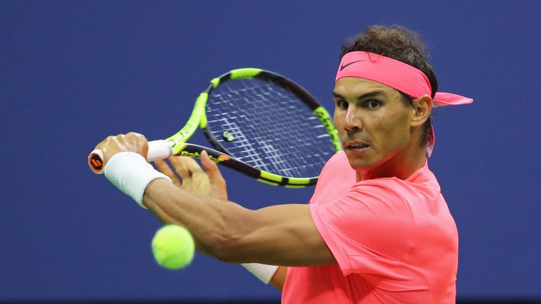 Rafael Nadal hits a return to Dusan Lajovic during their first round Men's Singles match at the US Open