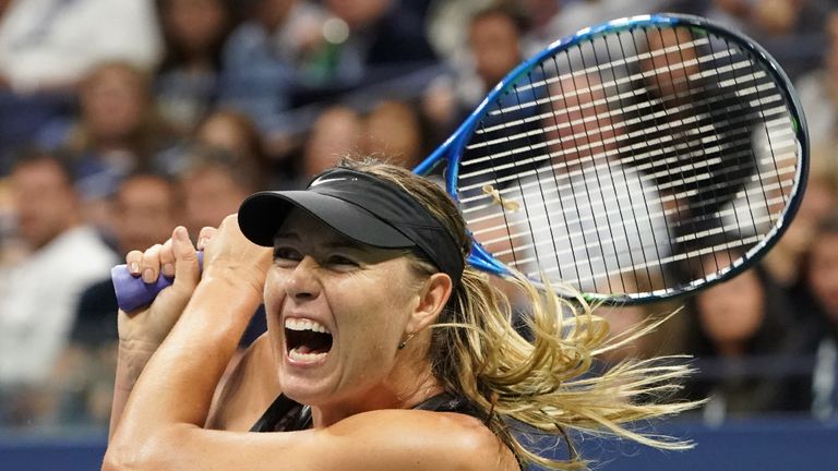 Maria Sharapova hits a return to Simona Halep during their Women's Singles match at the 2017 US Open