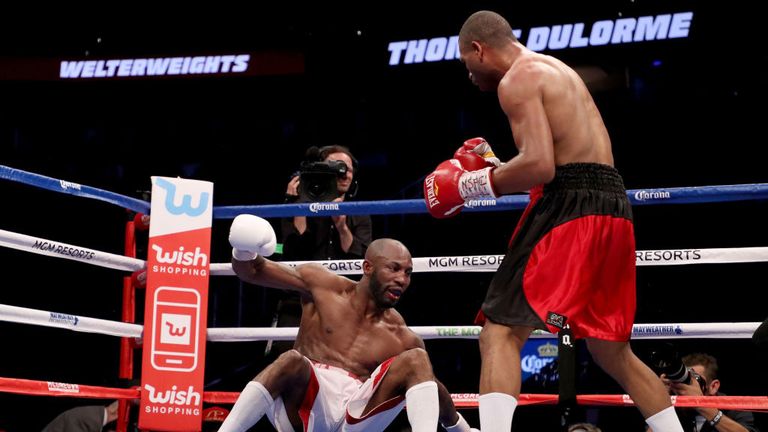Thomas Dulorme knocks down Yordenis Ugas during their welterweight bout on August 26, 2017 at T-Mobile Arena in Las Vegas