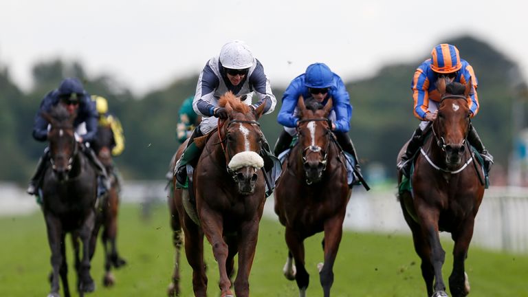 Ulysses (C, white cap) wins the Juddmonte International Stakes from Churchill (R)