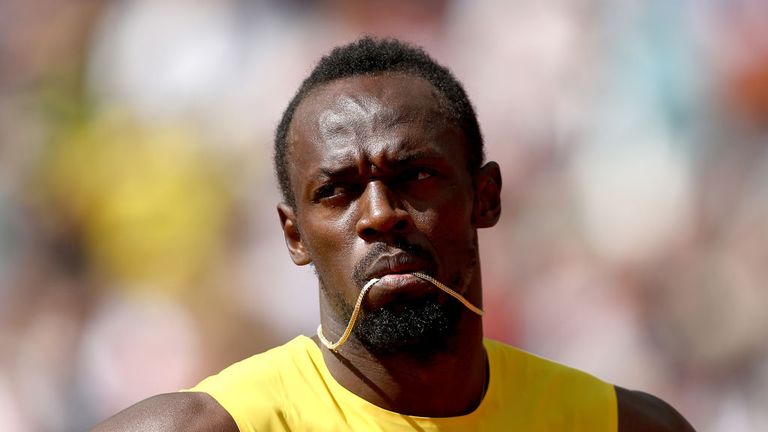 Usain Bolt of Jamaica prepares to compete in the Men's 4x100 Metres Relay heats during day nine in London