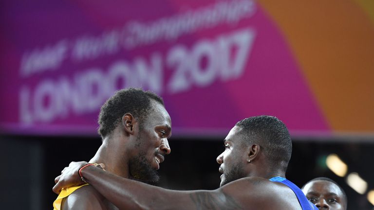 US athlete Justin Gatlin (R) embraces Jamaica's Usain Bolt after winning the final of the men's 100m athletics event at the 2017 IAAF World Championships a