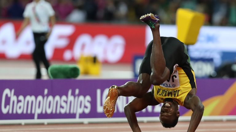 Jamaica's Usain Bolt falls after injuring himself in the final of the men's 4x100m relay