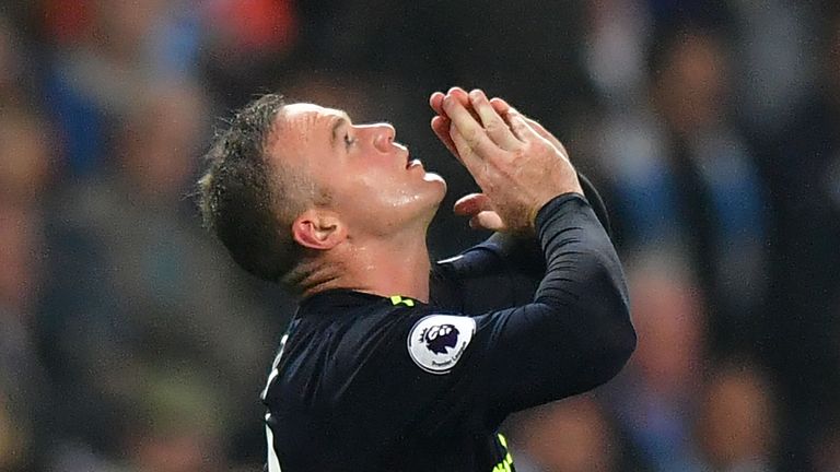 Wayne Rooney celebrates his goal in the first half at the Etihad