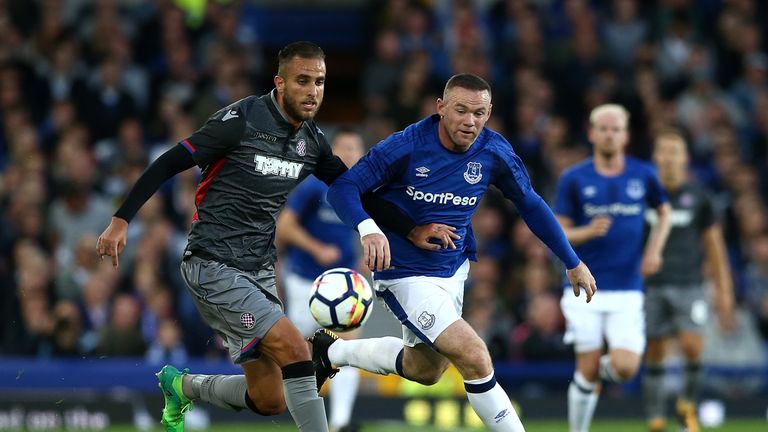 LIVERPOOL, ENGLAND - AUGUST 17:  Wayne Rooney of Everton competes with Gustavo Carbonieri of Hajduk Split during the UEFA Europa League Qualifying Play-Off