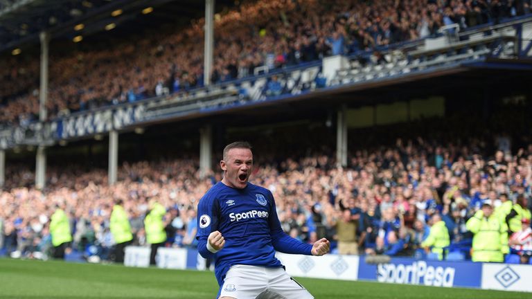 Everton's English striker Wayne Rooney celebrates scoring the opening goal during the English Premier League football match between Everton and Stoke City 