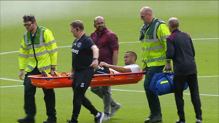 Winston Reid is carried off on a stretcher after picking up an injury during the warm up
