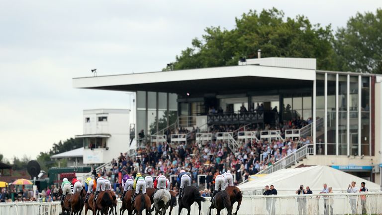 The field runs past the grandstands in the Worcester News Handicap hurdle race at Worcester Racecourse, Worcester.