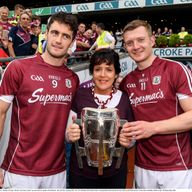 Margaret Keady with the Liam MacCarthy Cup and Galway captain, David Burke, left, and Joe Canning