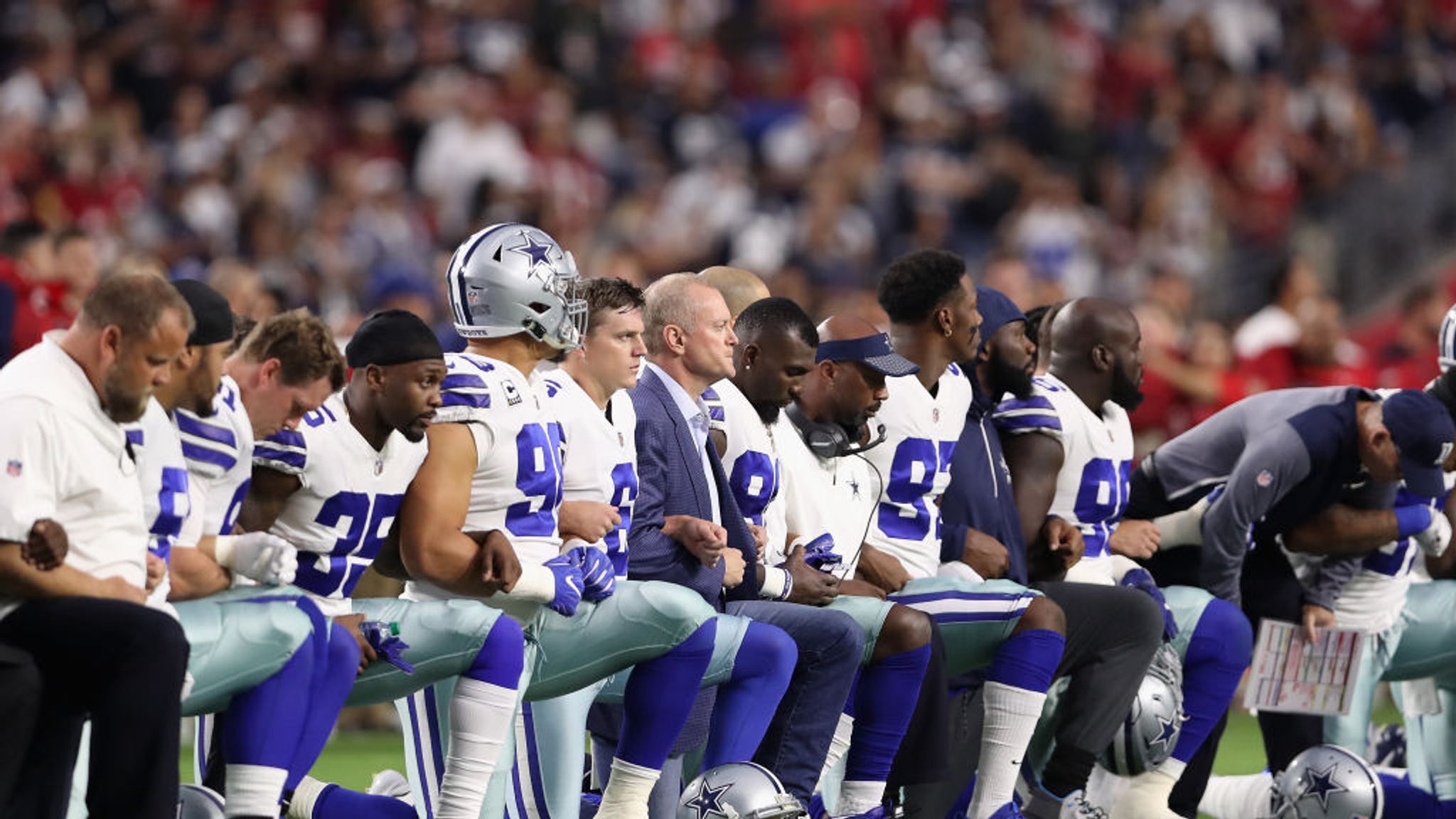 Download Dallas Cowboys Players Kneel in Unity Wallpaper