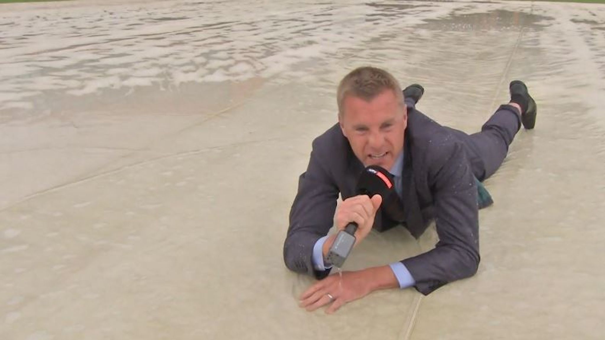 WATCH: Sky Sports News' David Fulton slides across wet covers at Old ...