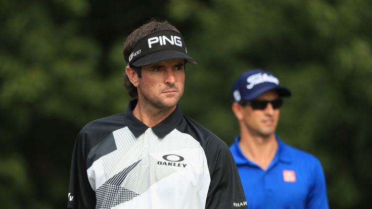 NORTON, MA - SEPTEMBER 02:  Bubba Watson of the United States and Adam Scott of Australia stand on the 14th hole during round two of the Dell Technologies 