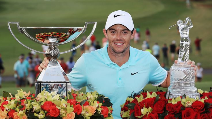 ATLANTA, GA - SEPTEMBER 25:  Rory McIlroy of Northern Ireland poses with the FedExCup and TOUR Championship trophies after his victory over Ryan Moore with