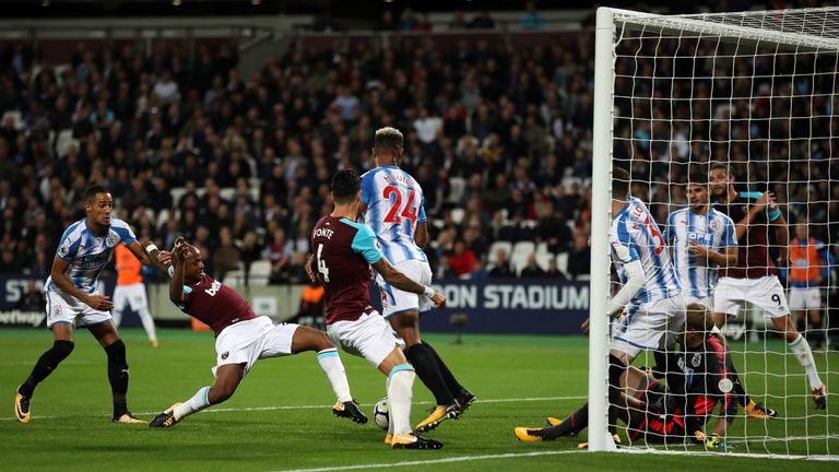 Andre Ayew pokes in West Ham's second after Huddersfield fail to clear Jose Fonte's header