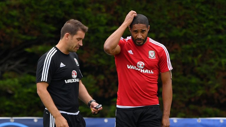 Wales captain Ashley Williams chats with Dr Adam Owen during Wales training at their Euro 2016 base camp