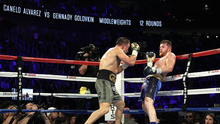 Canelo Alvarez (R) maneuvers against Gennady Golovkin during their WBC, WBA and IBF middleweight championship fight at the T-Mobile Arena on September 16, 
