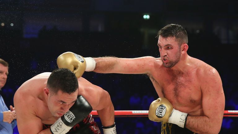 MANCHESTER, ENGLAND - SEPTEMBER 23:  Hughie Fury lands a right shot on Joseph Parker during the WBO World Heavyweight Title fight at Manchester Arena on Se