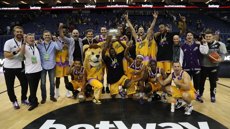 BETWAY ALL-STARS BASKETBALL.02 ARENA,LONDON.PIC;LAWRENCE LUSTIG. FINAL.LONDON LIONS V NEWCASTLE EAGLES .LIONS SKIPPER JOE IKHINMWIN LIFTS THE TROPHY