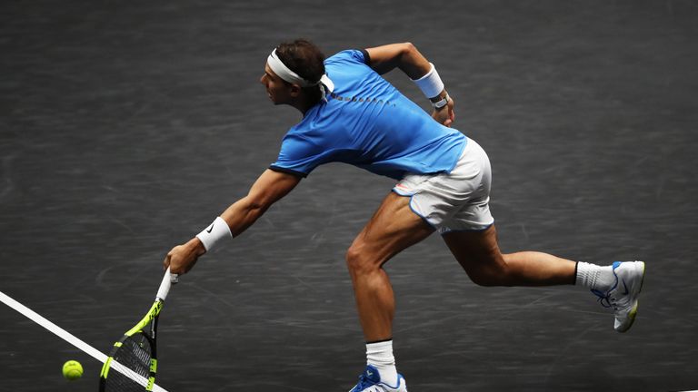 PRAGUE, CZECH REPUBLIC - SEPTEMBER 24:  Rafael Nadal of Team Europe plays a volley during his mens singles match against John Isner of Team World on the fi