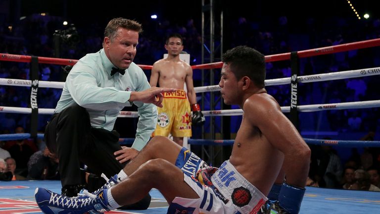 CARSON, CA - SEPTEMBER 09:  Roman Gonzalez of Nicaragua receives a ten count after being down for the first time against Srisaket Sor Rungvisai of Thailand