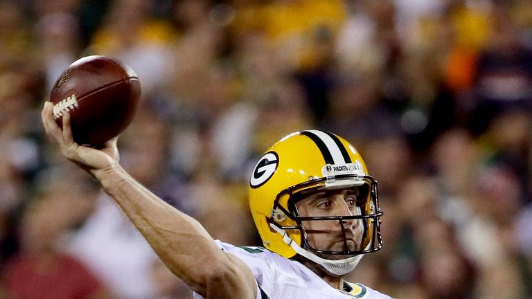 GREEN BAY, WI - SEPTEMBER 28:  Aaron Rodgers #12 of the Green Bay Packers drops back to pass in the first quarter against the Chicago Bears at Lambeau Fiel