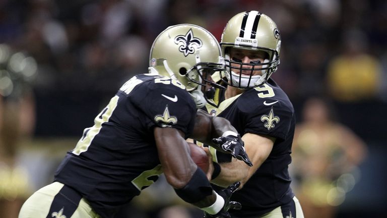NEW ORLEANS, LA - AUGUST 26:  Drew Brees #9 hands the ball to  Adrian Peterson #28 of the New Orleans Saints during the game against the Houston Texans at 