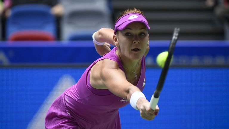 Agnieszka Radwanska of Poland hits a return against Ashleigh Barty of Australia during their third round women's singles match at the WTA Wuhan Open tennis