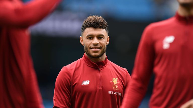 Alex Oxlade-Chamberlain warms up ahead of the Premier League football match between Manchester City and Liverpool