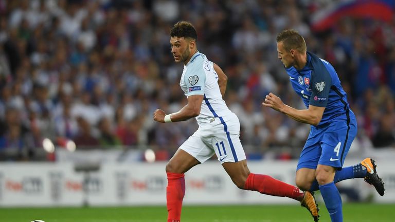 LONDON, ENGLAND - SEPTEMBER 04:  Alex Oxlade-Chamberlain of England is chased by Jan Durica of Slovakia during the FIFA 2018 World Cup Qualifier between En