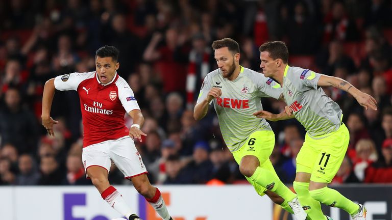 Alexis Sanchez of Arsenal goes past Marco Hoger in the first half