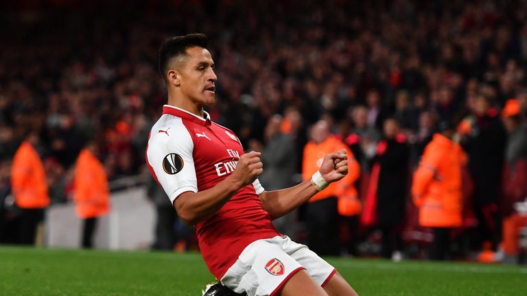 Alexis Sanchez celebrates his stunning goal to put Arsenal 2-1 up against Cologne